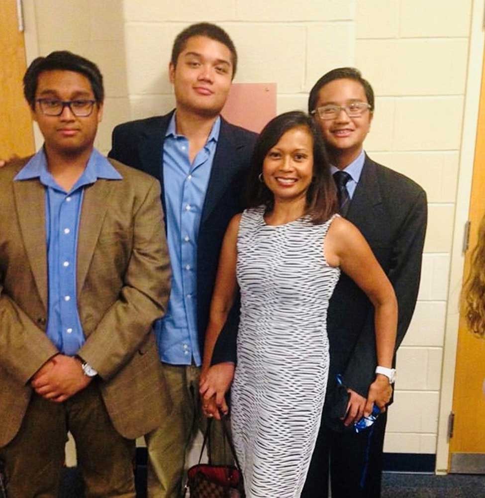 Image of Elaine Mosqueda with 3 young men