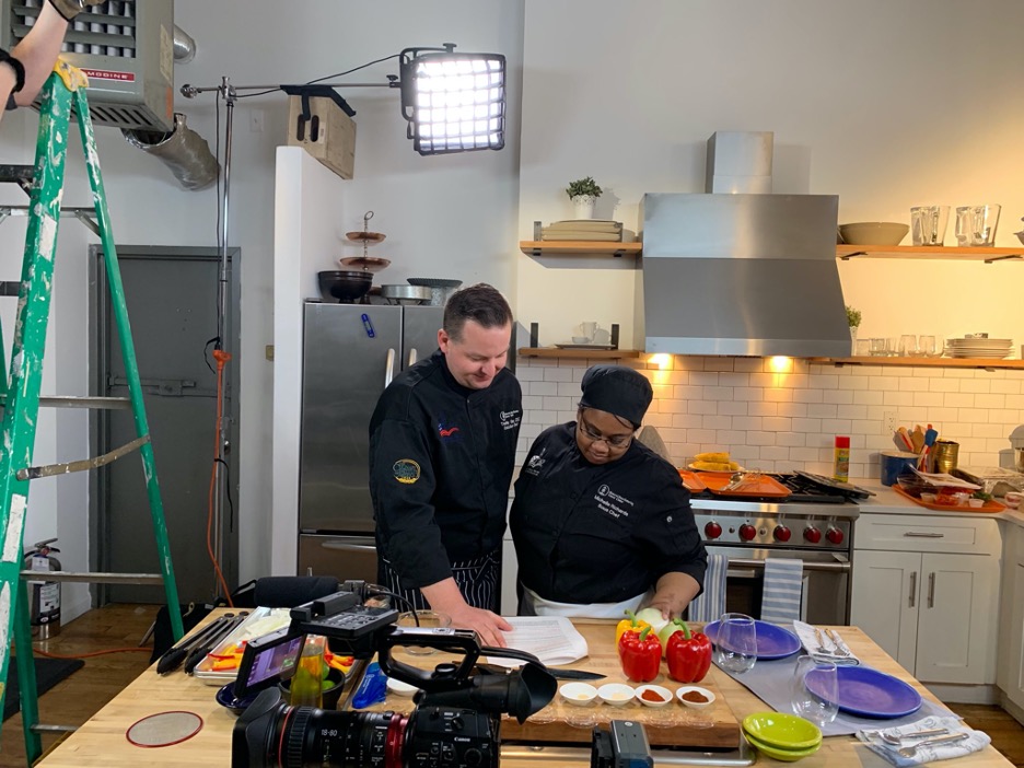 Two chefs at a shoot for a cooking program