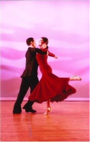 A couple ballroom dancing