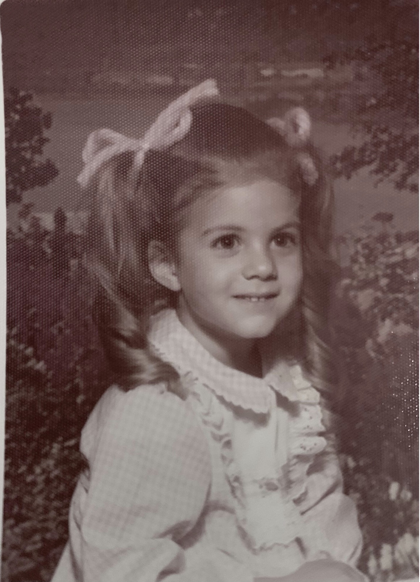 Photo of a young girl with hair tied in bunches