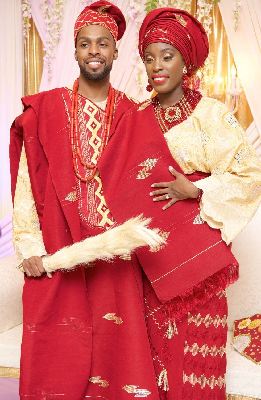 Wedding photo showing bride and groom in traditional outfits