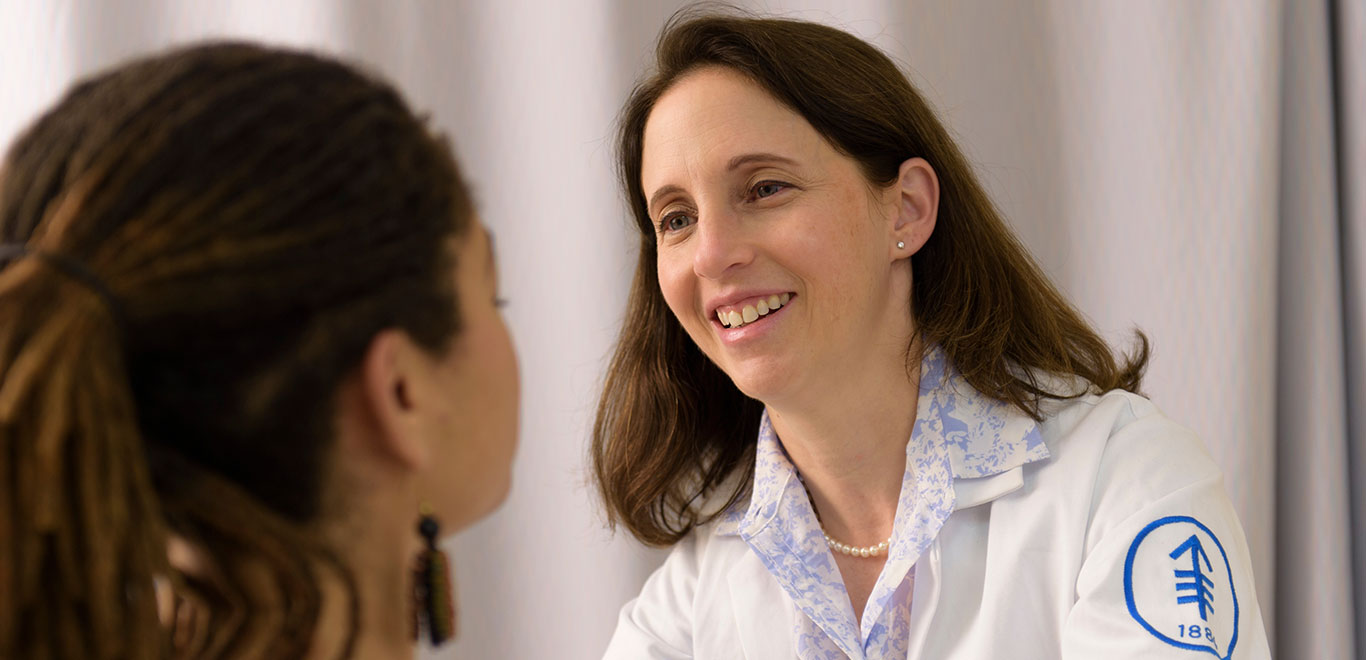 Medical colleague smiling at patient 