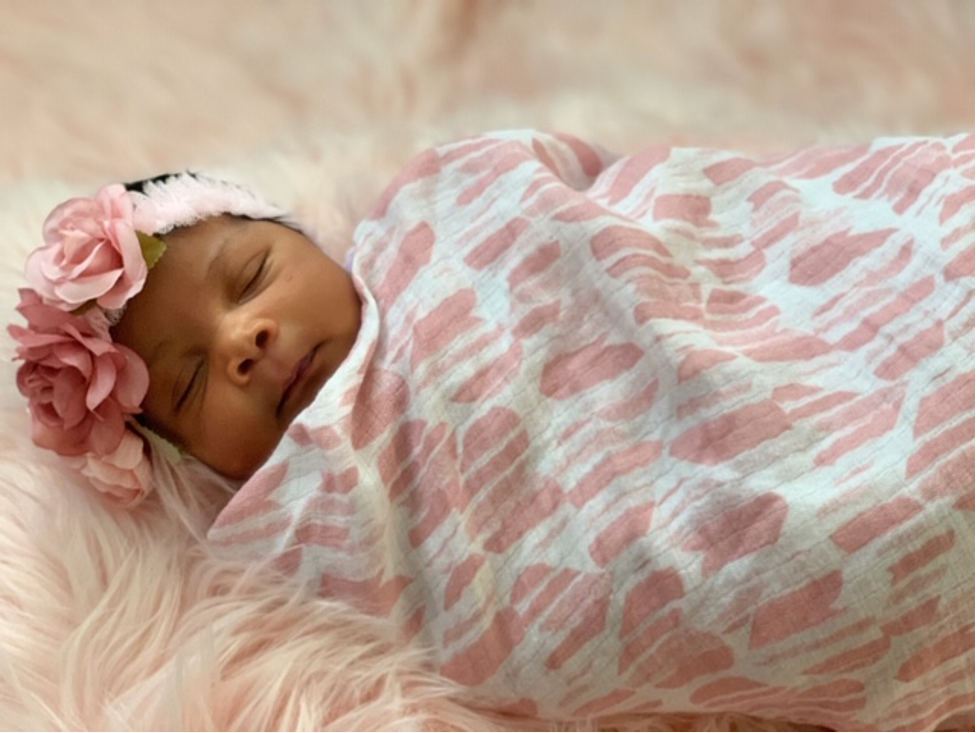 Sleeping baby with floral headband